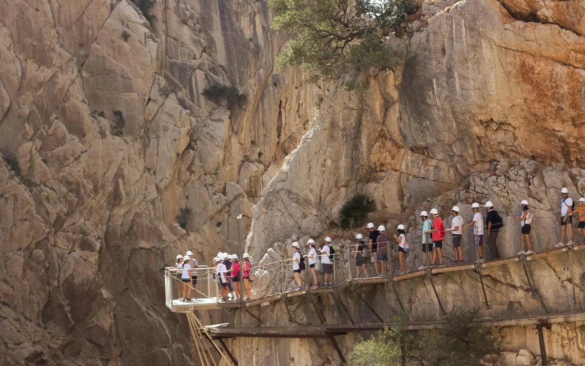 Walkers strung out along the Caminito del Rey boardwalk in the Gaitanes gorge