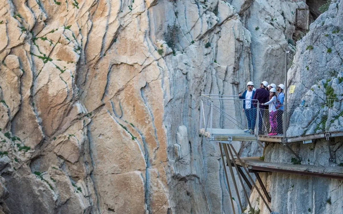 The crumbling remains of the original 1905 concrete walkway below the modern Caminito del Rey